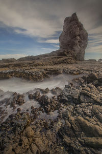 Scenic view of rock formation against sky