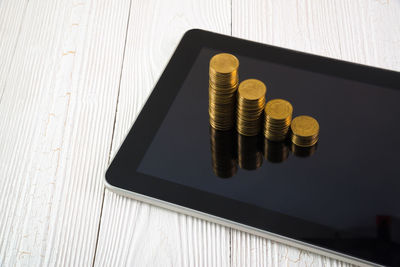 High angle view of coins on table