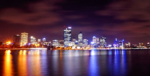 Illuminated city lit up at night