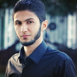 Portrait of young man standing outdoors