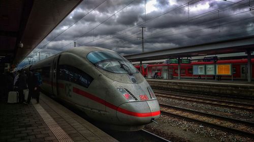 Train on railroad station platform against sky