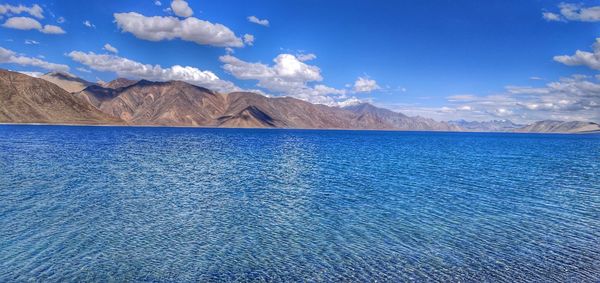 Scenic view of lake against blue sky