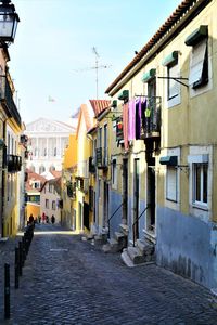 Alley amidst buildings in city