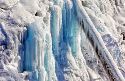 Full frame shot of icicles on snow covered landscape