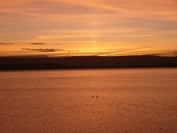 Scenic view of sunset over sea