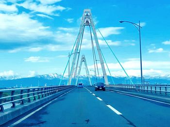 Bridge over road against sky