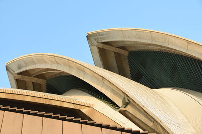 Low angle view of building against clear blue sky