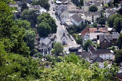 High angle view of houses and trees in town