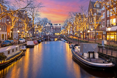 City scenic from amsterdam at christmas time in the netherlands at sunset