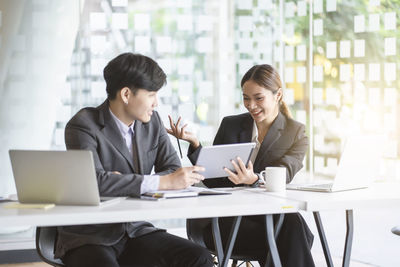 Woman working on table in office