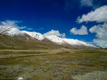 Scenic view of snowcapped mountains against sky