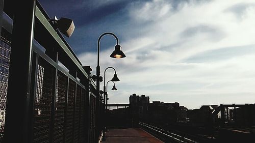 Low angle view of building against cloudy sky