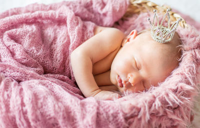 Cute baby sleeping in crib at home