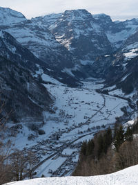 Scenic view of snow covered mountains