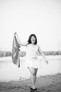 Portrait of woman standing in water