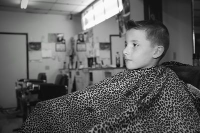 Boy sitting in room