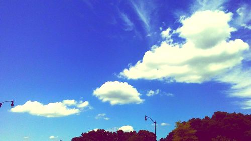 Low angle view of blue sky and clouds