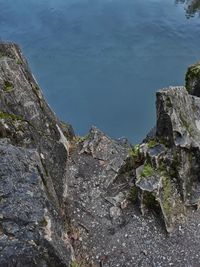 High angle view of rock formations by sea