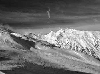 Scenic view of snow mountains against sky