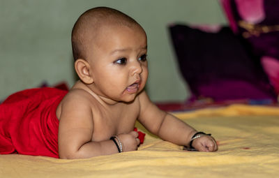 Baby infant cute innocent facial expression with blurred background