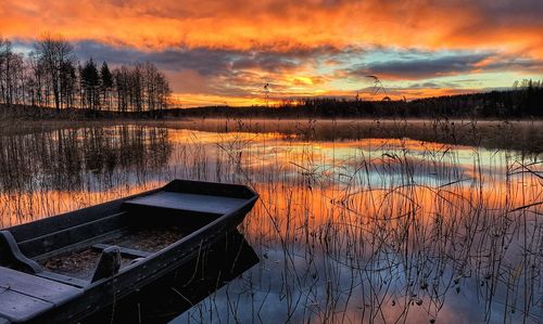 Scenic view of lake against orange sky