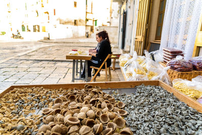 Man sitting at market stall