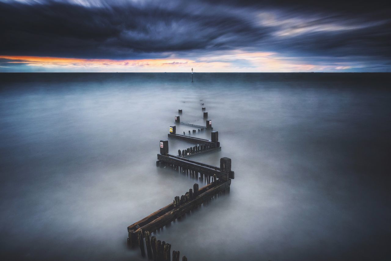 sky, cloud - sky, water, cloudy, cloud, nature, tranquility, weather, scenics, outdoors, beauty in nature, no people, tranquil scene, overcast, travel destinations, day, idyllic, ocean, tourism, blue