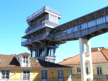 Low angle view of buildings against clear blue sky. santa just a lift. lisbon portugal