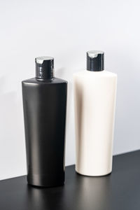 Close-up of bottles against white background