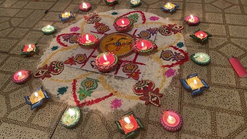 High angle view of illuminated christmas lights on tiled floor