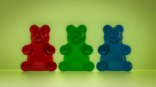 Close-up of stuffed toy against green background