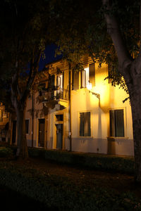 Illuminated building against sky at night