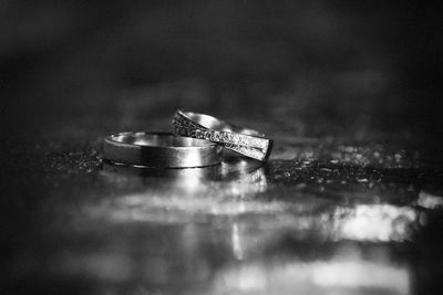 Close-up of wedding rings on table