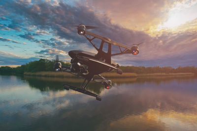 Close-up of drone on lake during sunset 