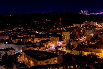 High angle view of illuminated buildings in city at night