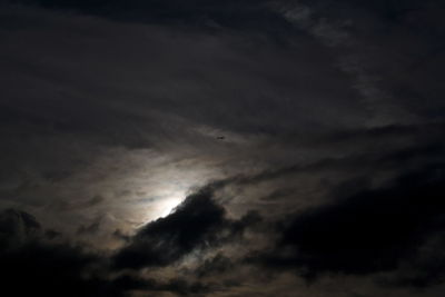 Low angle view of dramatic sky at night