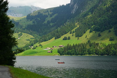 Scenic view of lake by mountains