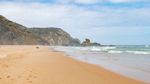 Scenic view of beach against sky