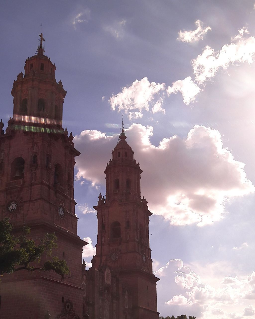 LOW ANGLE VIEW OF CHURCH AGAINST CLOUDY SKY