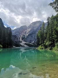 Scenic view of lake and mountains against sky