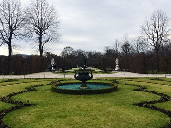 Statue in park against sky