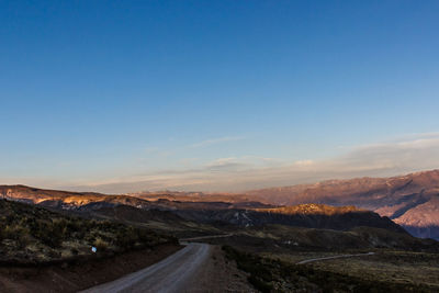 Road amidst landscape against sky