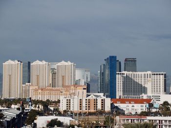 Buildings in city against sky