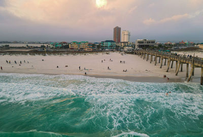 Scenic view of beach against sky during sunset