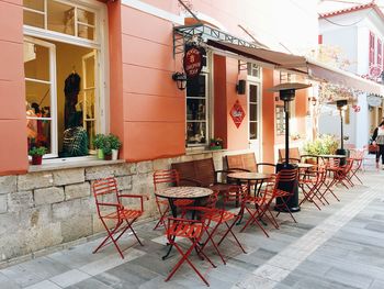 Chairs and table against building