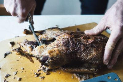 Close-up of hand preparing food