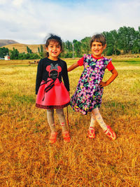 Portrait of smiling girl on field