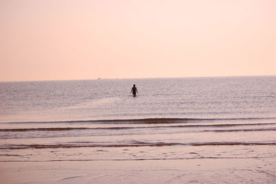 Scenic view of sea against clear sky during sunset