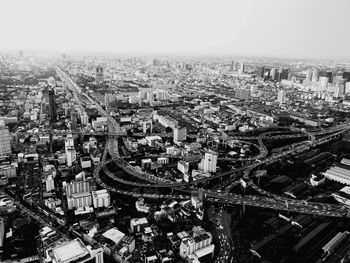 High angle view of city buildings against sky