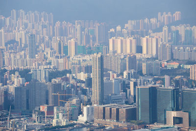 Aerial view of modern buildings in city against sky